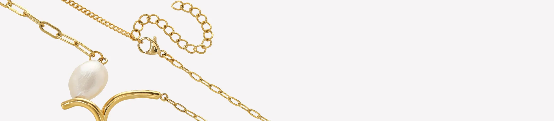 Gold chain necklace with a white pearl pendant and a gold crescent moon setting, shown on a plain light gray background.